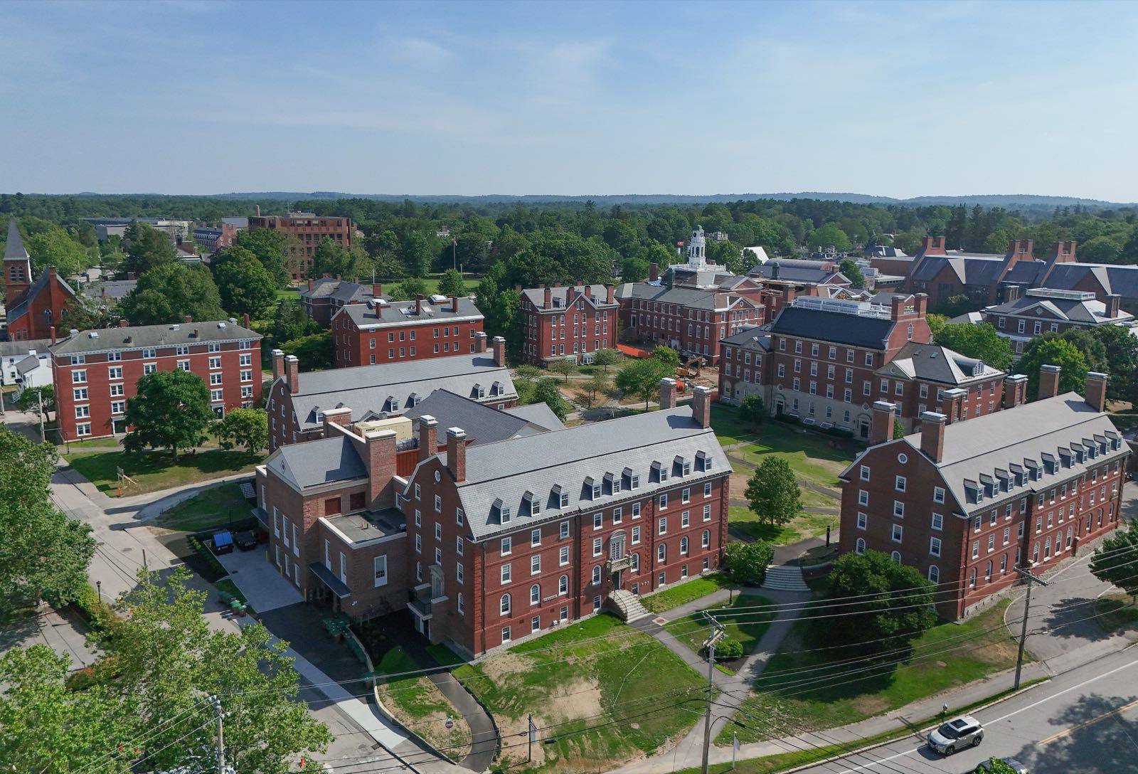 Aerial view of brick campus buildings and green quads in Exeter, New Hampshire